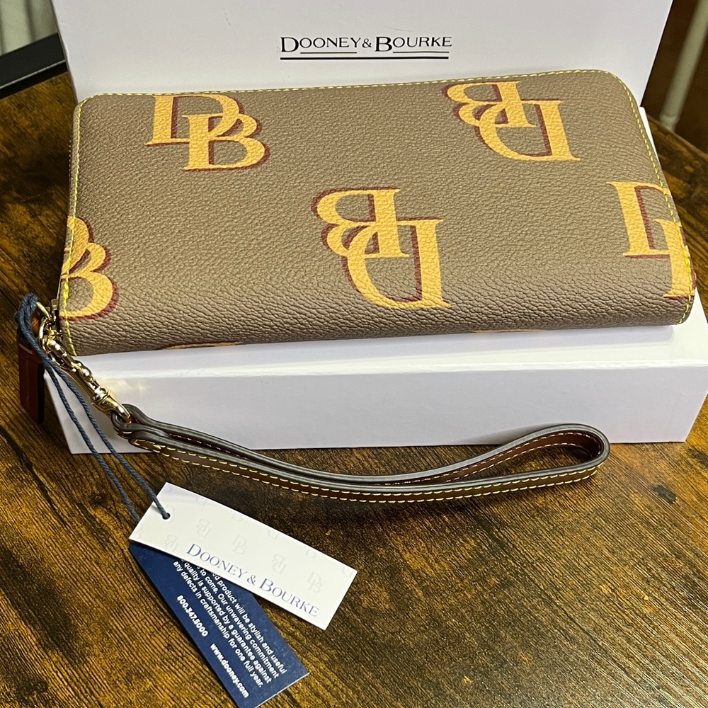 Dooney & Bourke Brown Wallet with Tan Logo Pattern and Wristlet